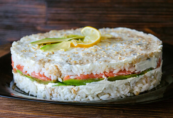 Sushi cake with salmon and avocado.