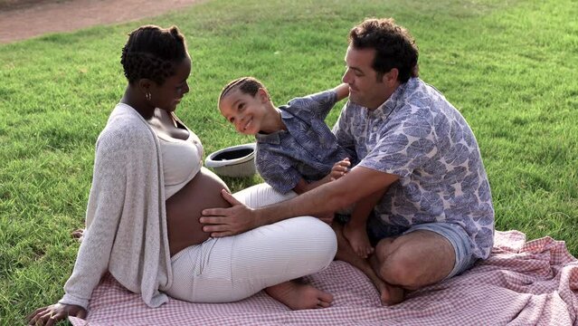 Multiracial family enjoy day at park