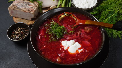 Traditional Ukrainian Russian borscht . Bowl of red beet root soup borsch with white cream . Beet Root delicious soup . Traditional Ukraine food cuisine