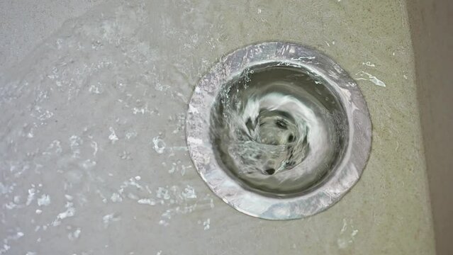 Water draining in the kitchen sink