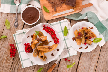 Mini churros with chocolate dipping sauce.