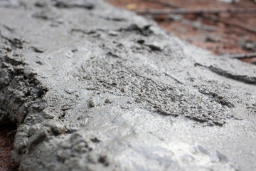 Close-up of a concrete mix. Construction concept. Close-up view of concrete mix with space for text.