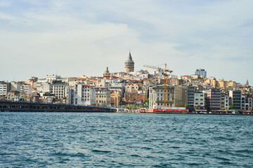 Fototapeta na wymiar View of the Galata Tower across the Bosphorus Bay from the Fatih area. Istanbul, Turkey