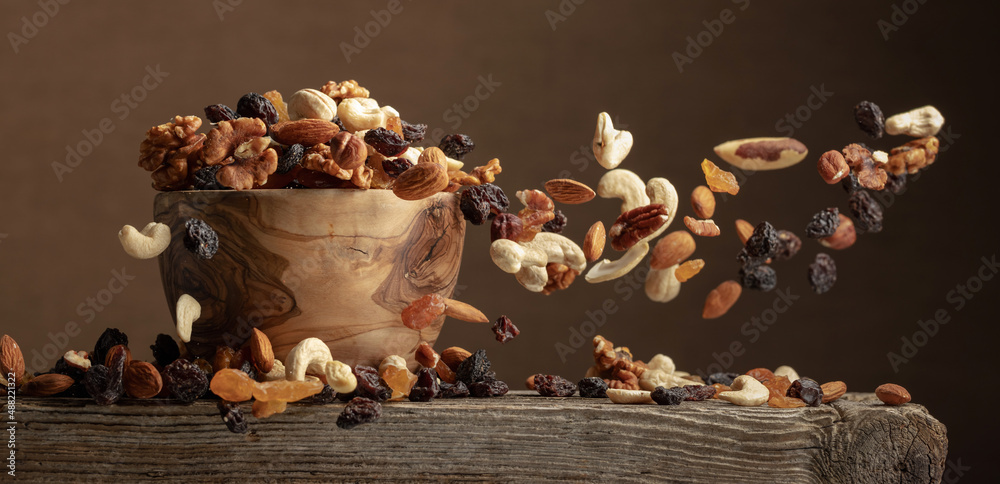 Wall mural flying dried fruits and nuts. - Wall murals