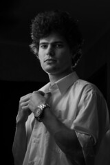 Caucasian man portrait in white shirt in black and white