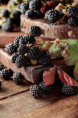 Fresh blackberries on a wooden table.