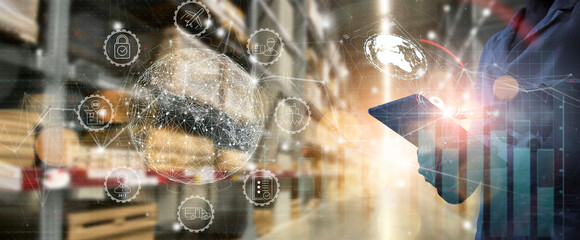 Businesss Workers using digital tablet computer cargo and tracking delivery for Transportation and global network of smart logistics in blur warehouse background.
