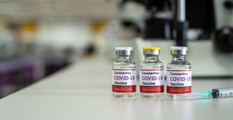 Concept vaccine against covid-19 coronavirus Omicron BA.2 , a bottle of vaccine in a scientific laboratory that is a prototype for invention and development.