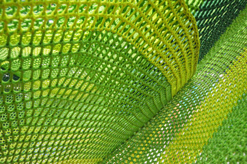 Texture mesh woven in a children's climbing center bright green macro