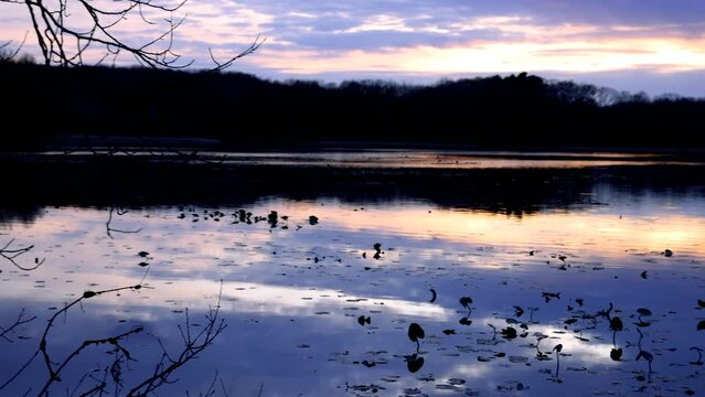Panoramic view of kent lake landscape under evening sun light in rural Michigan