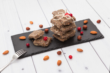 Homemade raw vegan dessert paste halva on a dark plate
