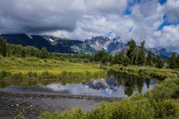 Tetons in reflection pond at Schwabacher's landing Grand Tetons National park, Wyoming on a cloudy day