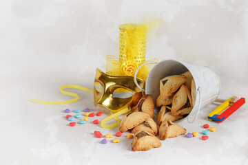 Carnival attributes and тraditional jewish sweets hamantaschen cookies. Purim 
