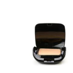 Compact cosmetic powder in a black powder box isolated on a white . Free space for text.