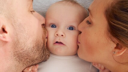 Happy parents with his newborn baby, top view. Happy family. Healthy newborn baby with mom and dad....
