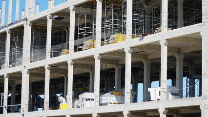 Structure building of steel structure roof truss frame installation by mobile crane under the construction building in the factory with blue sky. building structure.