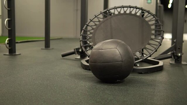 Trampoline ball medicine background sport, in the afternoon round muscle in ym for arm fitness, blank balle. Concrete