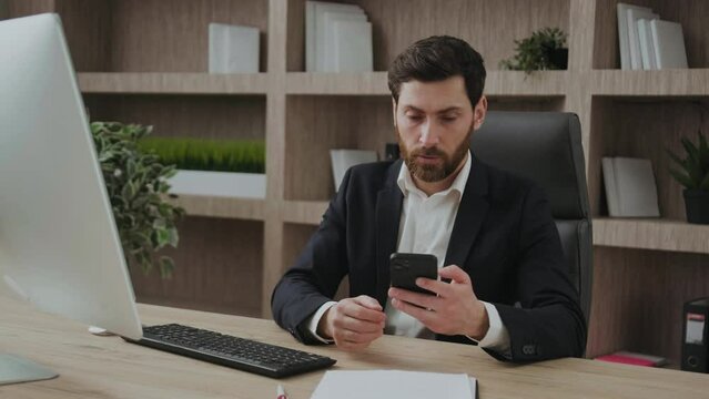Angry businessman stressed about smartphone problem at workplace, frustrated executive with the Internet or phone bugs