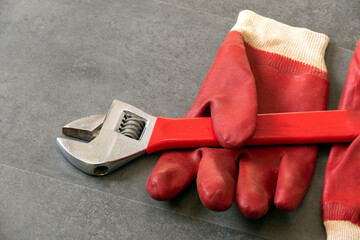 For work safety, it is necessary to work with gloves, a wrench, thick plastic gloves are standing...