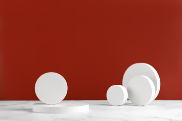 Minimal scene - empty stage with white round podiums on white and red background. Pedestal for product and packaging mockups