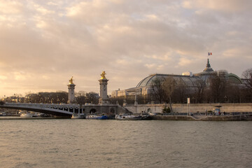Fototapeta na wymiar View of Paris near Pont Alexandre III over the Seine at sunset, France
