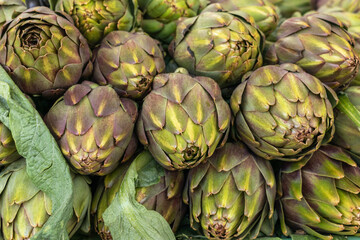 Obraz premium Artichokes closeup, food background, organic food, background of artichokes.