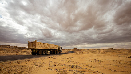 The truck is driving along the road leading through the Black and White Desert Egypt