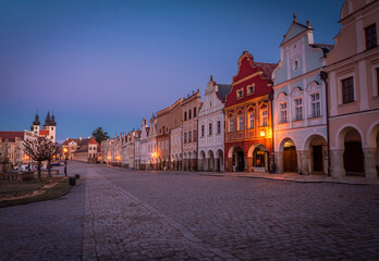 Telc town in winter night with orange street lamps