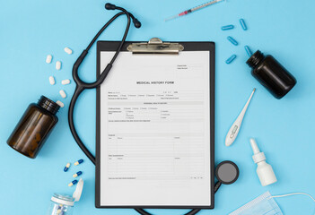 A tablet with a medical history form on a blue background. Medical diagnosis of a doctor's prescription.