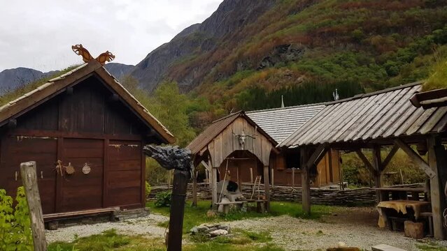Houses on viking village surrounded by fjord landscape