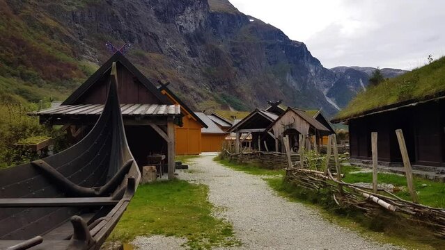 Viking ship and viking houses on viking village