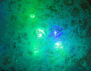soap bubbles and oil in the turquoise spectrum, blur, abstract background. Bubbles of water, oil, dishwashing detergent. Macro shot of soap and oil bubbles Abstract background. Selective focus. Banner