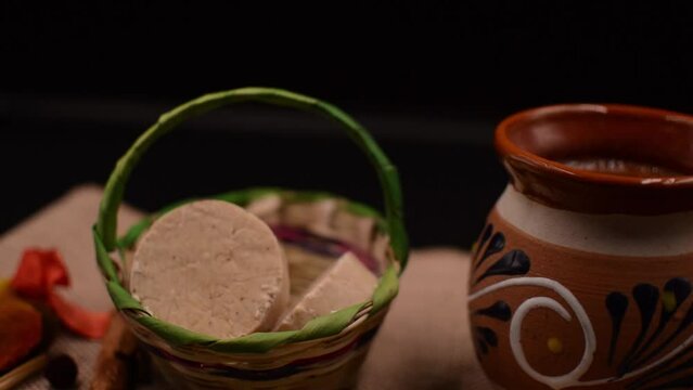 Taking a mazapan from a traditional basket