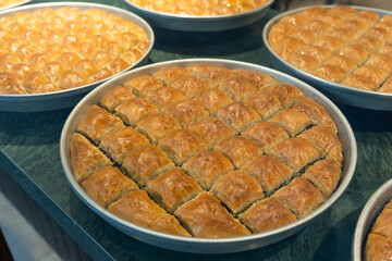 Baklava with pistachios in tray. Baklava is one of the most popular and traditional Turkish desserts.