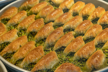 Baklava with pistachios in tray. Baklava is one of the most popular and traditional Turkish...