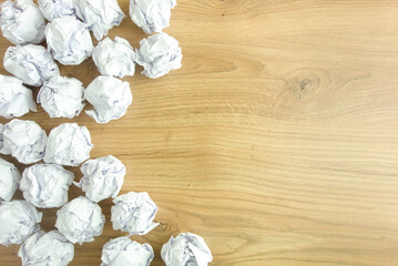 Crumpled paper balls on desk