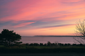 Deal peninsula seen at dusk from Ramsgate UK on an evening with a pretty pink sky.