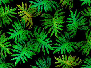 Seamless pattern with green tropical plants on a black background. 
