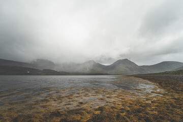 Lake shore with mountain background