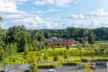 High angle view of summer landscape in Alachua, Florida near Gainesville with building cars parking...