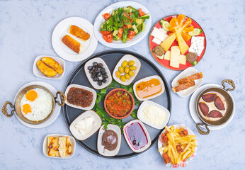 Classical traditional turkish breakfast with eggs omlet salad cheese meze french fries olives honey kaymak - obrazy, fototapety, plakaty