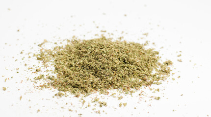 crushed marijuana, white background, room for text