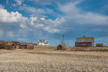 Fototapeta premium Abandoned farm buildings on the prairies in Saskatchewan, Canada