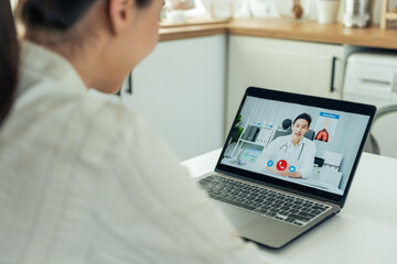 Asian young woman patient talking virtual online with medical doctor. 