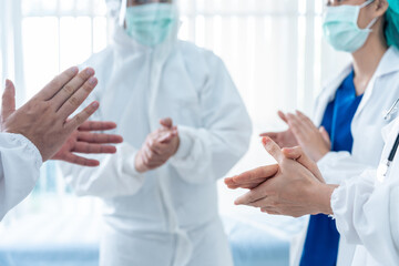 Close up Group of Asian doctor and nurse clapping the hands with smile.