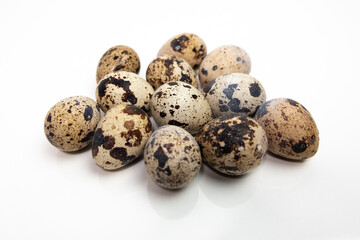 Quail eggs on a white table. Close up.