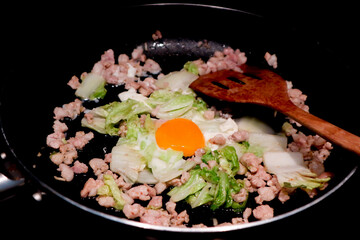 stir fried vegetable, stir fried Chinese cabbage or stir fried cabbage with minced pork in the pan or cooking