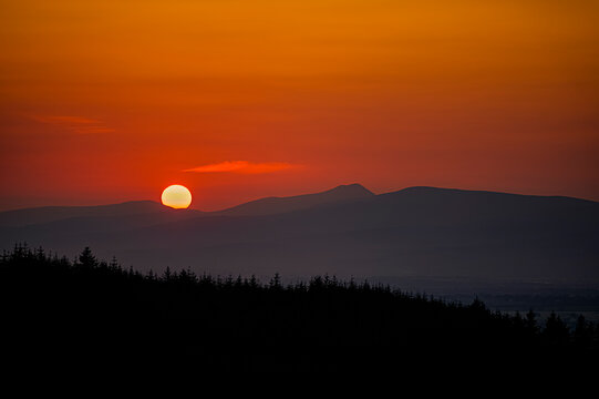 sunset in the mountains over clonmel