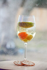 Champagne with fruit in a wine glass 