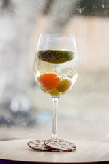 Champagne with fruit in a wine glass 